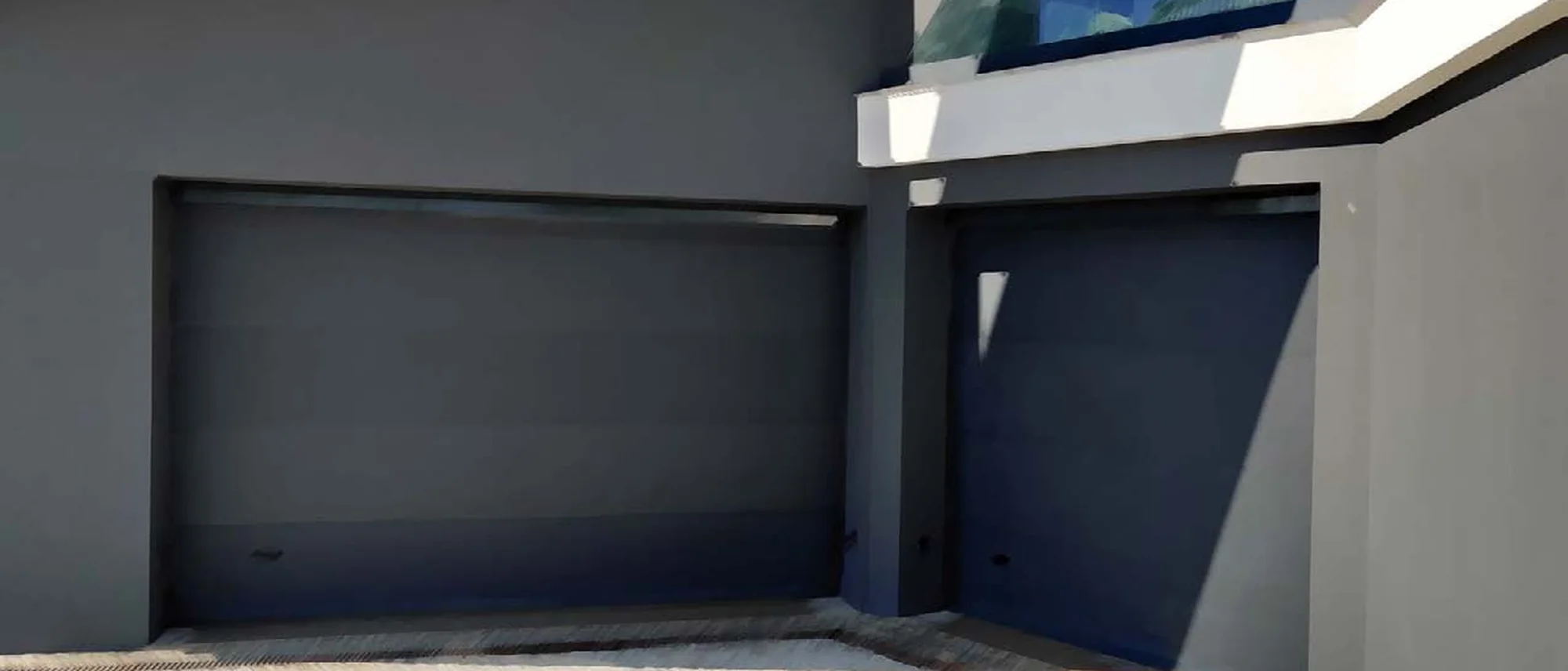 Fachada industrial moderna com portões seccionados ao anoitecer