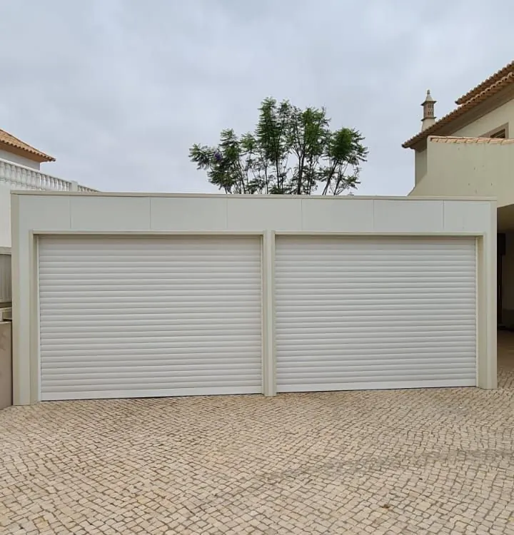 Two white roller doors on a double garage