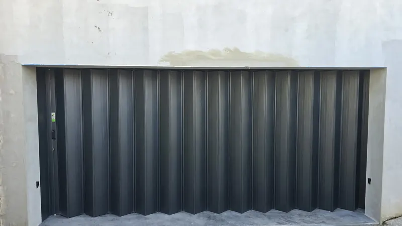 Dark aluminium folding garage door