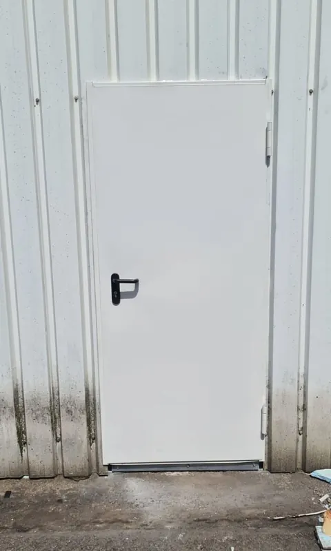 Metal service door on an industrial building