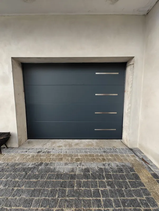 Anthracite sectional door with stainless steel handles