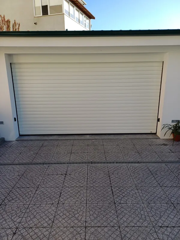 White residential sectional garage door