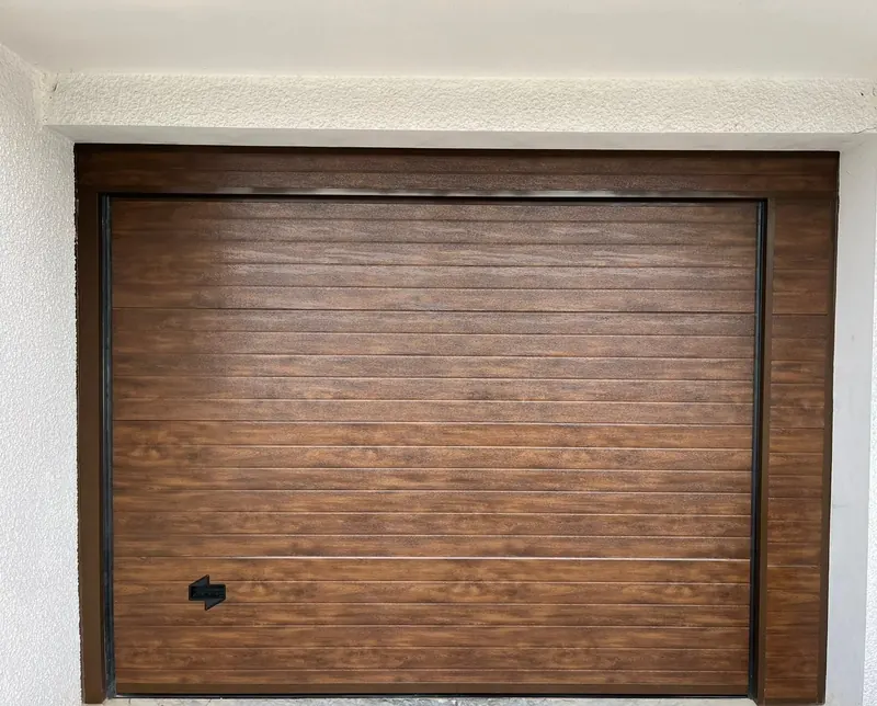 Sectional door with wood-effect finish