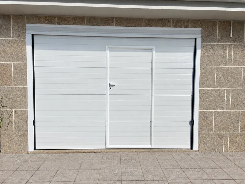White sectional door with integrated pedestrian door