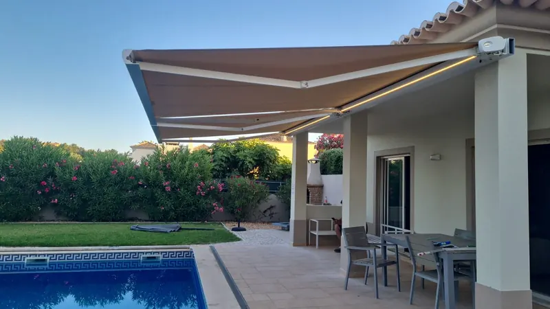 Motorised awning with LED over terrace and pool